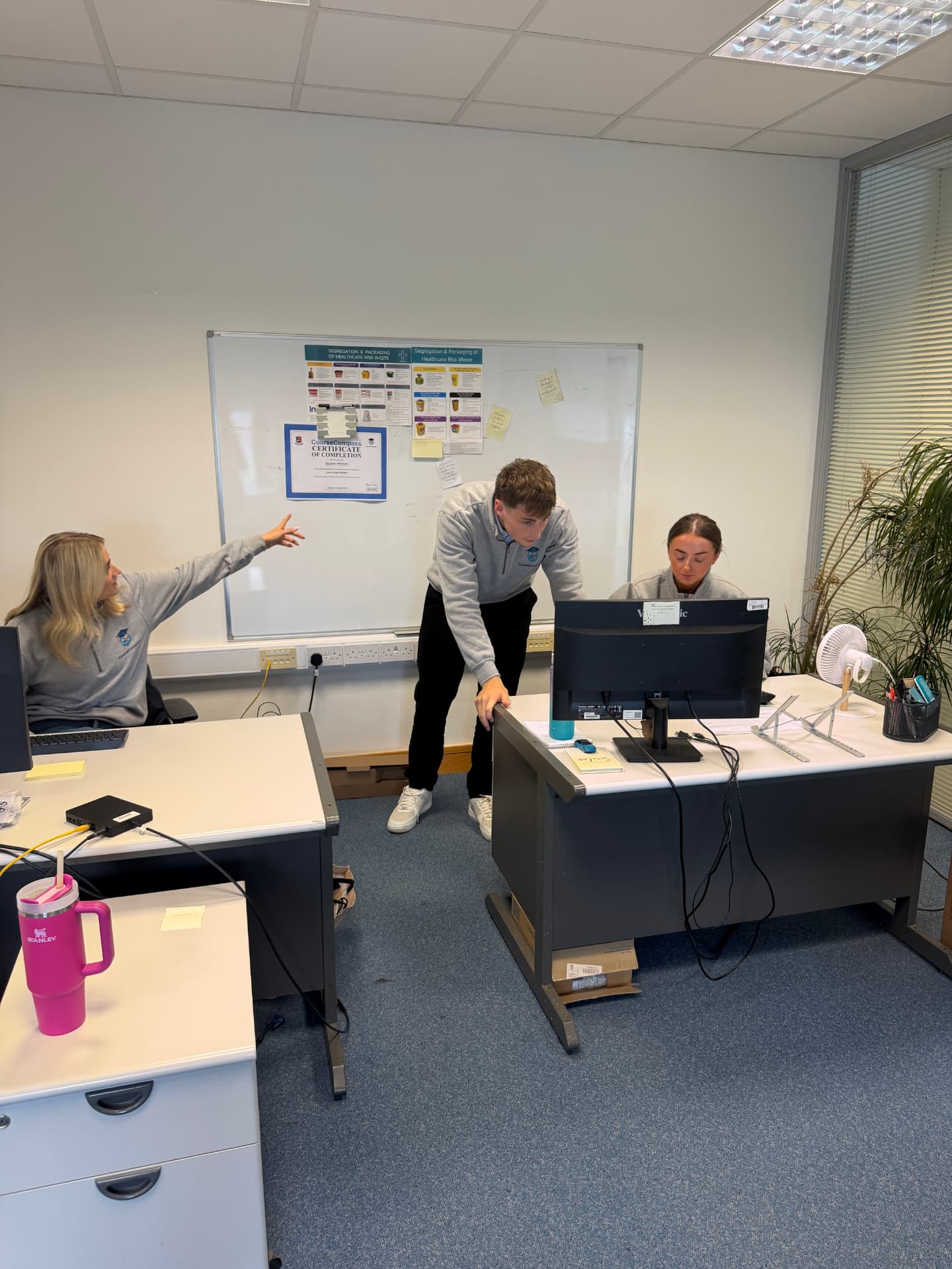 The CourseCompass team at work in their office